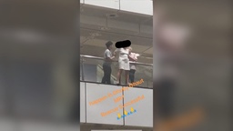 Woman standing on edge of railing at Dhoby Ghaut MRT station rescued by 2 individuals featured image